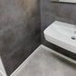  »Teide« SPC Vinylboden Unique Fliesenoptik an der Wand im Badezimmer